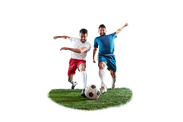 Image showing Football players tackling for the ball over white background