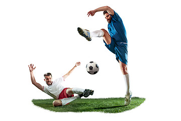 Image showing Football players tackling for the ball over white background