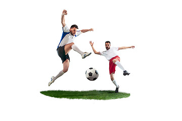 Image showing Football players tackling for the ball over white background