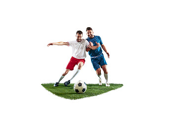 Image showing Football players tackling for the ball over white background