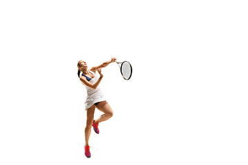 Image showing Adult woman playing tennis. Studio shot over white.