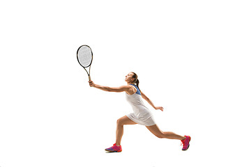 Image showing Adult woman playing tennis. Studio shot over white.