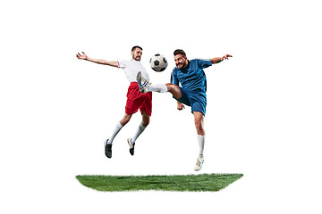 Image showing Football players tackling for the ball over white background