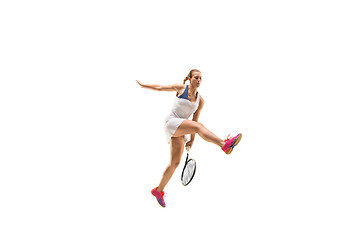 Image showing Adult woman playing tennis. Studio shot over white.