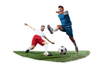 Image showing Football players tackling for the ball over white background