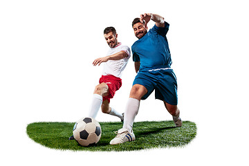 Image showing Football players tackling for the ball over white background