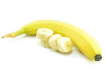 Image showing Ripe yellow banana with sliced bananas