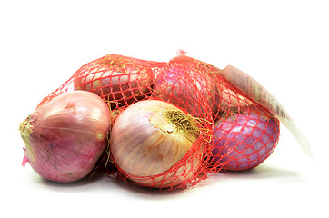 Image showing Pack of red onions isolated