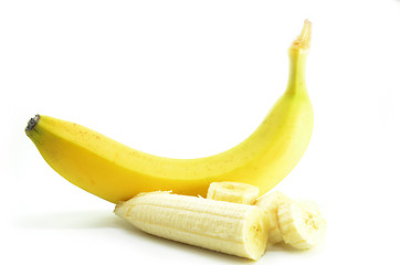 Image showing Ripe yellow banana with sliced bananas