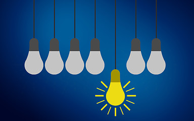 Image showing One light bulb standing out from other bulbs