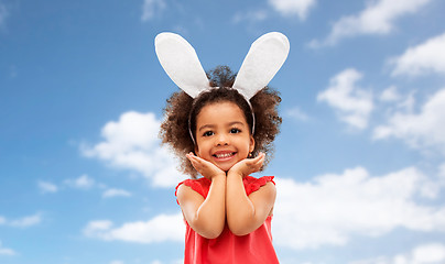 Image showing happy little girl wearing easter bunny ears posing