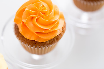 Image showing cupcake with frosting on confectionery stand