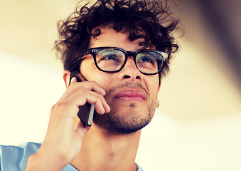 Image showing man with smartphone calling on city street