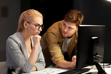 Image showing business team with computer at night office