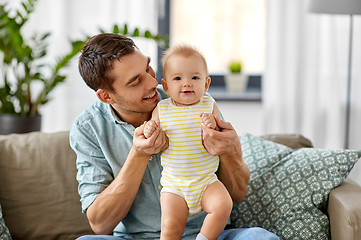 Image showing father with little baby daughter at home