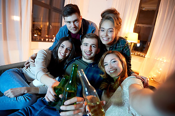 Image showing happy friends taking selfie at home party