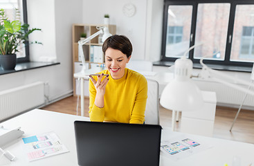 Image showing designer recording voice by smartphone at office