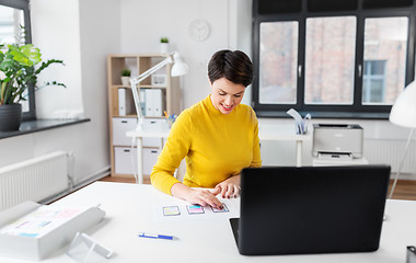 Image showing ui designer working on user interface at office