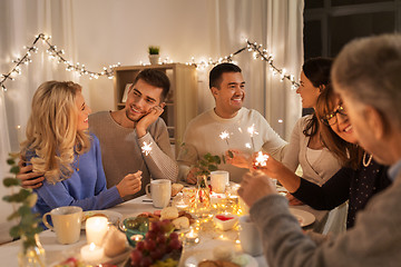 Image showing family with sparklers having dinner party at home