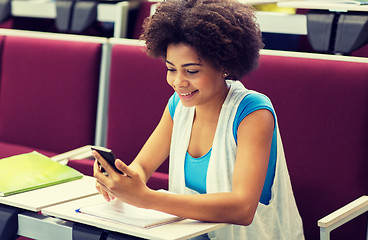 Image showing african student girl with smartphone on lecture
