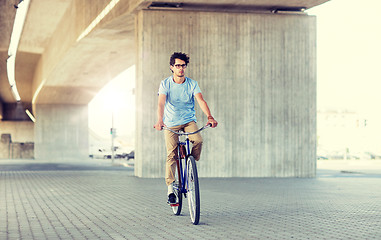 Image showing young hipster man riding fixed gear bike