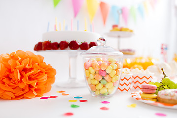 Image showing glass jar with candy drops at birthday party