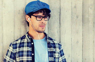 Image showing man with earphones listening to music on street