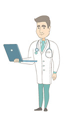 Image showing Young caucasian doctor using a laptop.