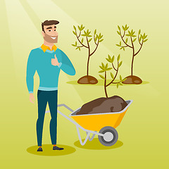 Image showing Man pushing wheelbarrow with plant.