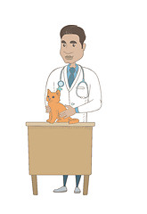 Image showing Young hispanic veterinarian examining cat.