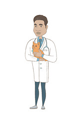 Image showing Young hispanic veterinarian with cat in hands.