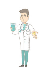 Image showing Young pharmacist giving pills and glass of water.
