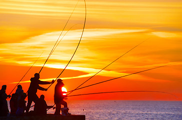 Image showing Fishers at sunset