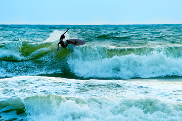 Image showing Surfer in the ocean. Bali