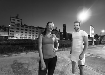 Image showing couple warming up and stretching