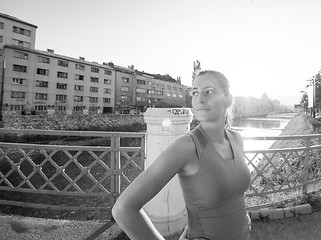 Image showing portrait of a jogging woman at sunny morning