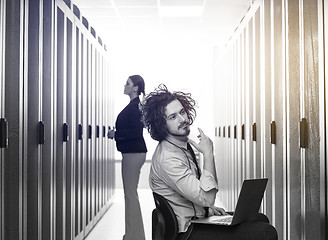 Image showing technicians working together on servers