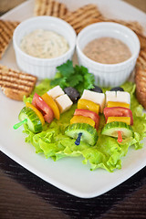 Image showing toast with cheese vegetables and olive on the stick