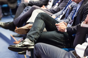 Image showing Row of business people sitting at seminar.