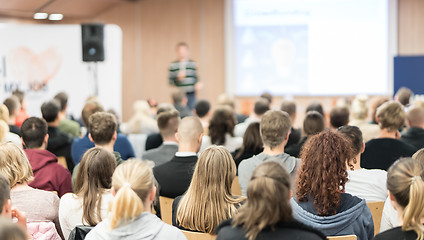 Image showing Speaker giving presentation in lecture hall at university