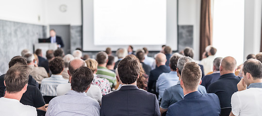 Image showing Business speaker giving a talk at business conference event.