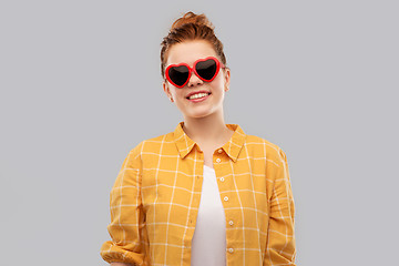 Image showing red haired teenage girl in heart-shaped sunglasses