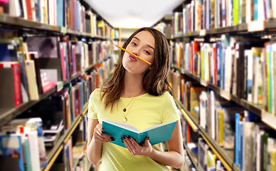 Image showing teenage student girl with notebook and pencil