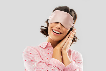 Image showing happy young woman in pajama and eye sleeping mask