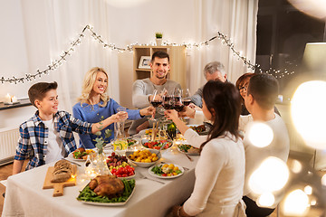 Image showing happy family having dinner party at home