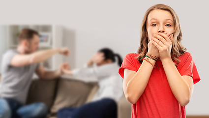 Image showing girl covering mouth over her parents having fight