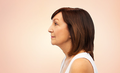 Image showing profile of senior woman over white background