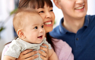 Image showing close up of happy mixed-race family with baby son