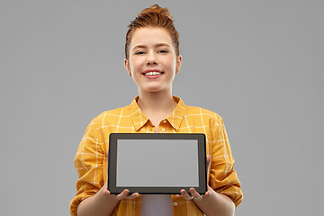 Image showing red haired teenage girl showing tablet computer