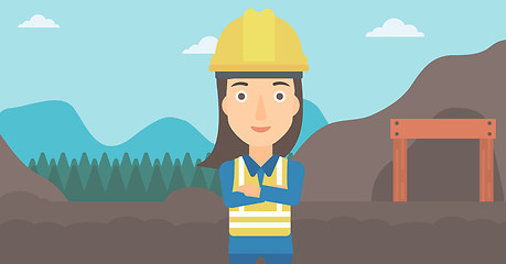 Image showing Miner with mining equipment on background.